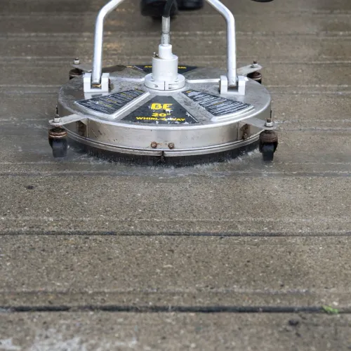 a surface washer on the concrete